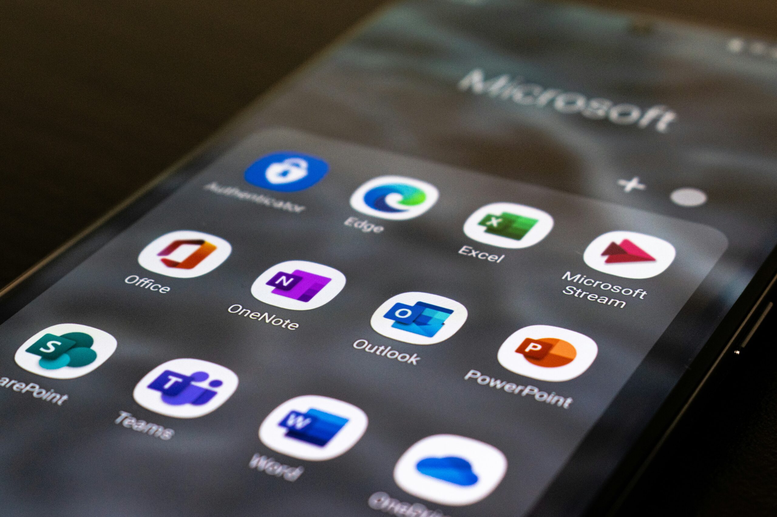 Phone screen showing Microsoft apps.